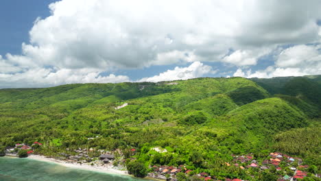 Coastal-Village-And-Lush-Green-Hills-On-Sunny-Summer-Day