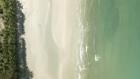 Aerial-birds-eye-view-down-shot-of-pristine-tropical-beach-in-Thailand