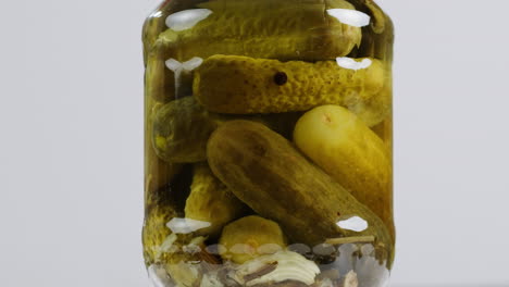 pickled cucumbers in a glass jar