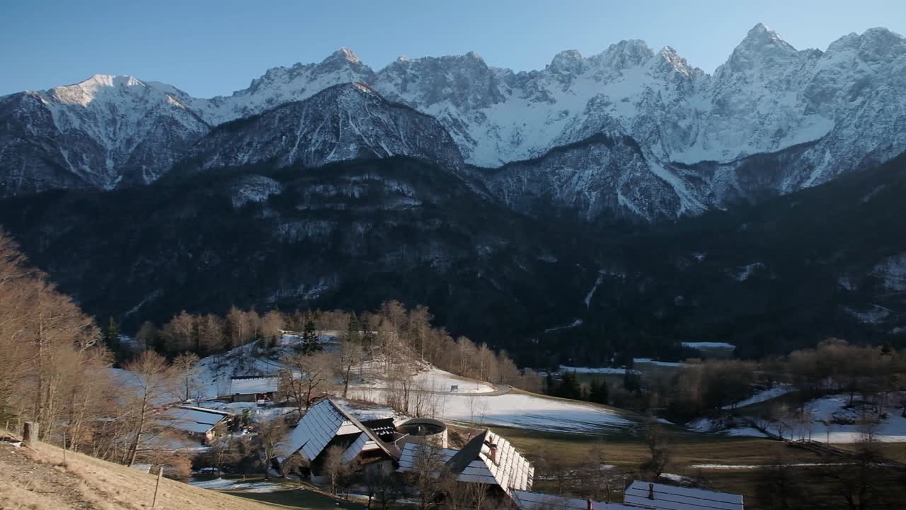 A village near Gozd Martuljek looking over the mountains covered in snow in the northern area of Slovenia. Kranjska gora and spik mountain