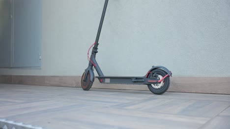E-scooter-Parked-Outdoor.-Eco-friendly-Mode-Of-Transportation.-tilt-up