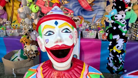 clown heads and toys at a carnival