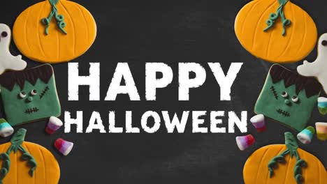 Animation-of-happy-halloween-text-over-pumpkins-and-sweets