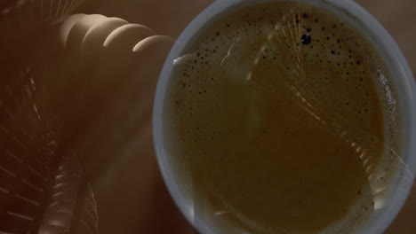 animated 3d render showing ceramic coffee cup steaming over wooden beads threading on diagonal rods