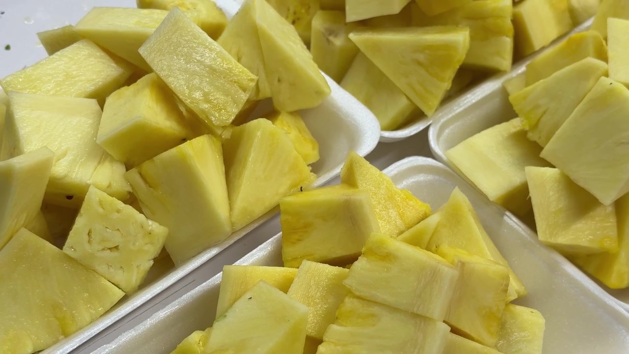 Fresh Pineapple Chunks in White Styrofoam Trays