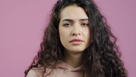 woman hiding face with hand