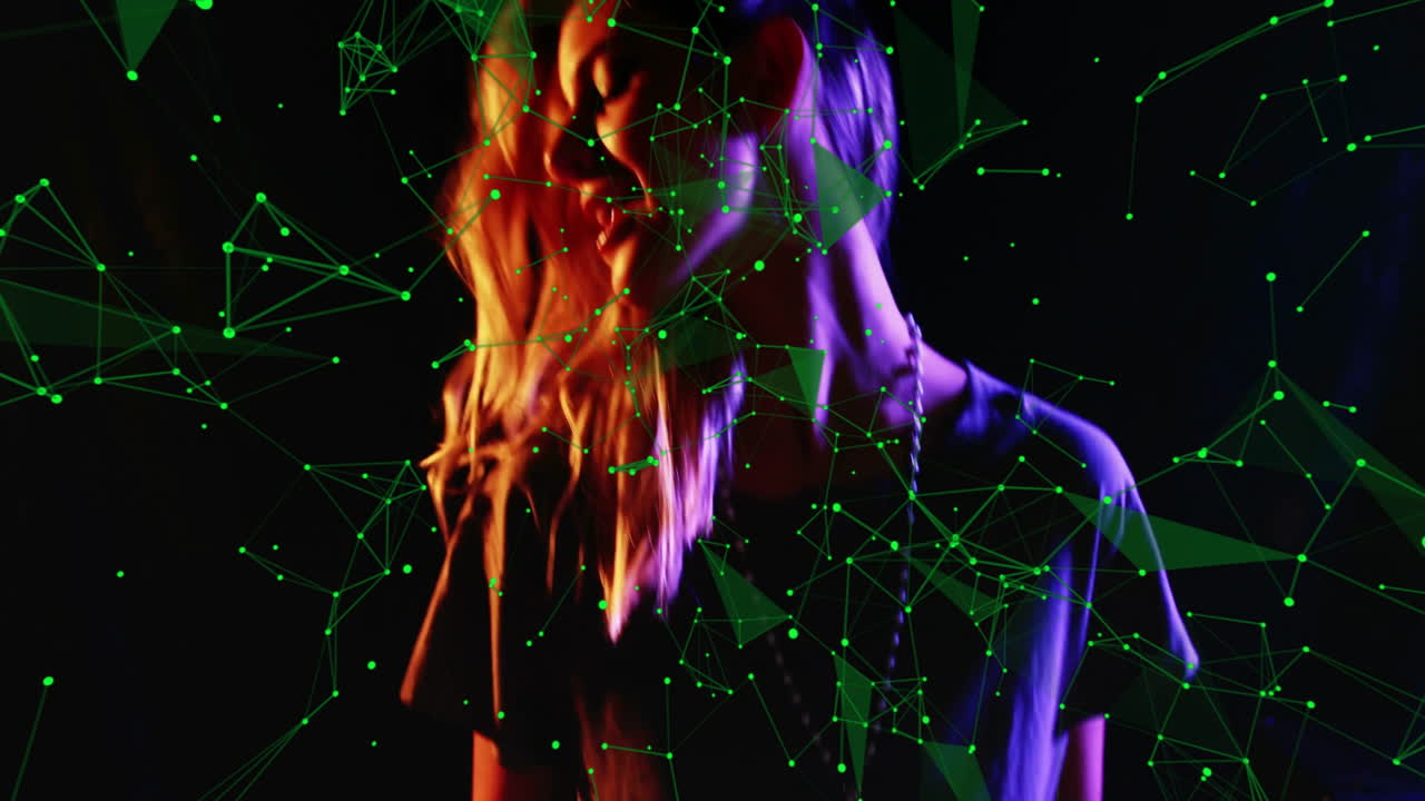 woman standing against studio backdrop, overlaying green tech data visualization network