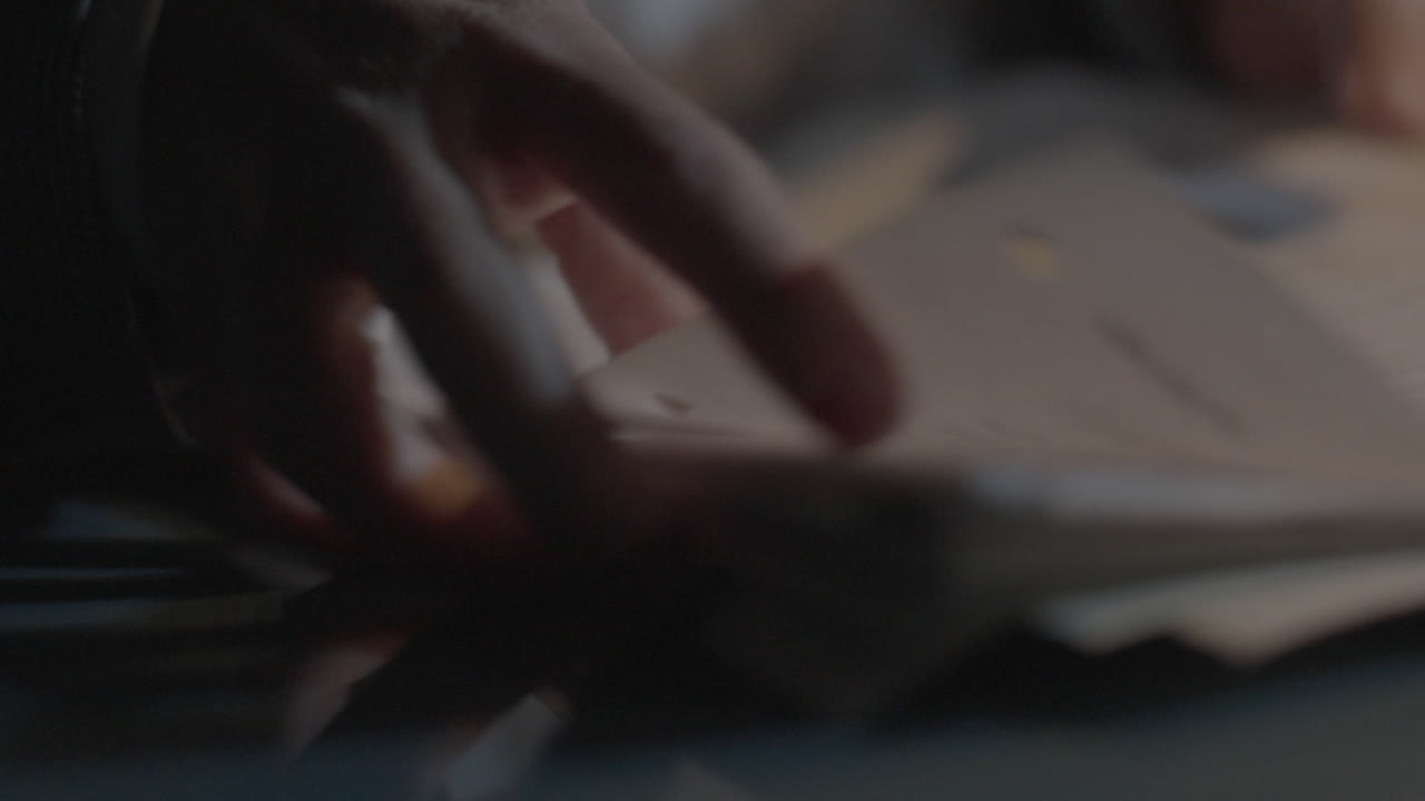 Close-up of a bag and documents on a table