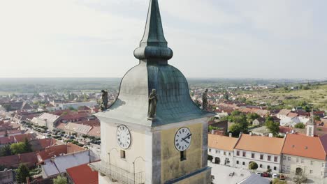 statue of saint on the church tower - aerial shot