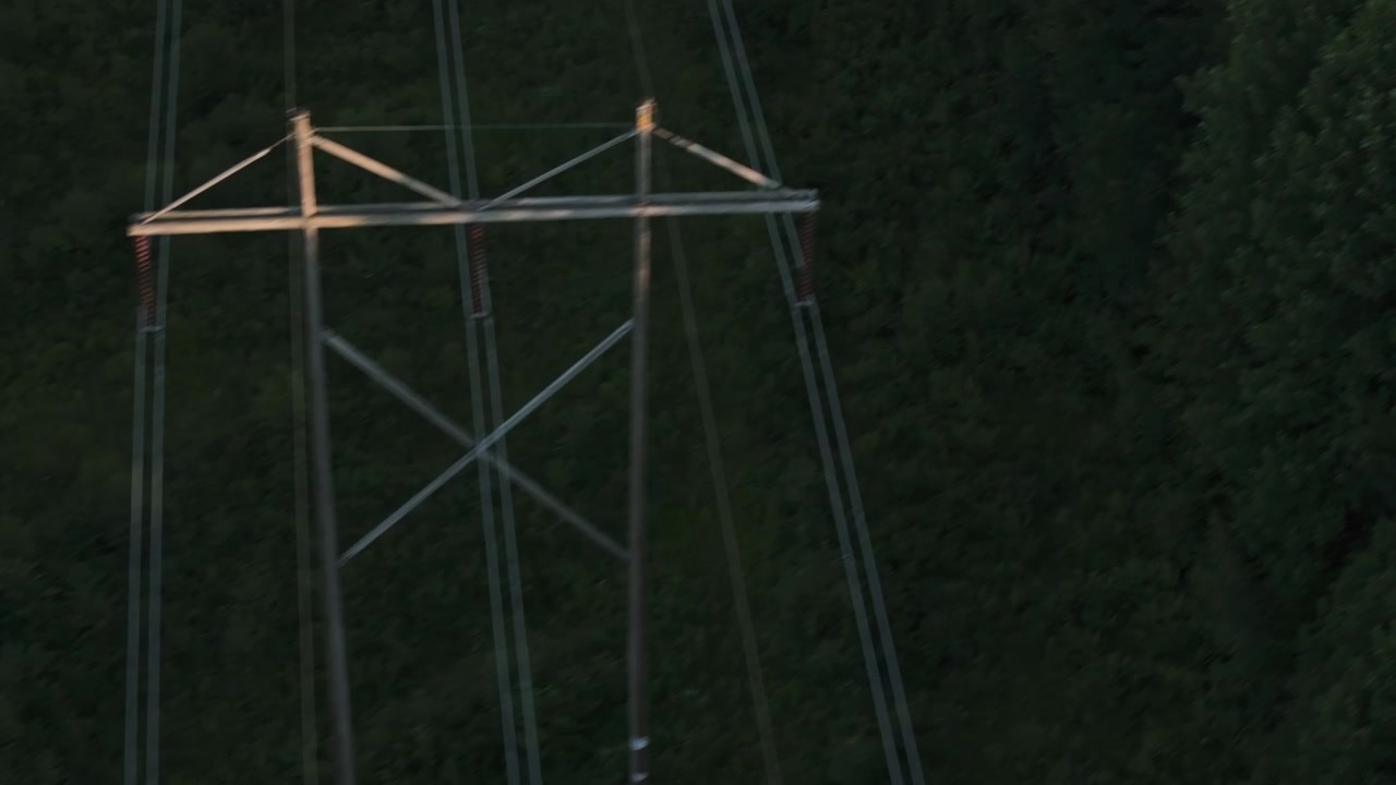 Aerial view of power lines in an Upstate New York forest. Shot during the summer.