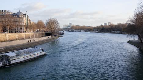 sightseeing boat cruising on seine river in paris