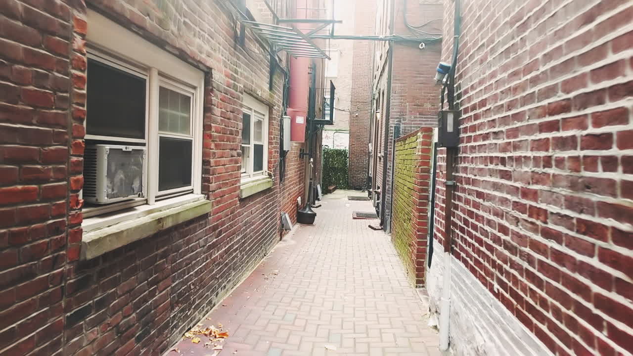 Walking down an old alley by the Old Town Church on Salem Street and Hull Street on a cloudy morning.