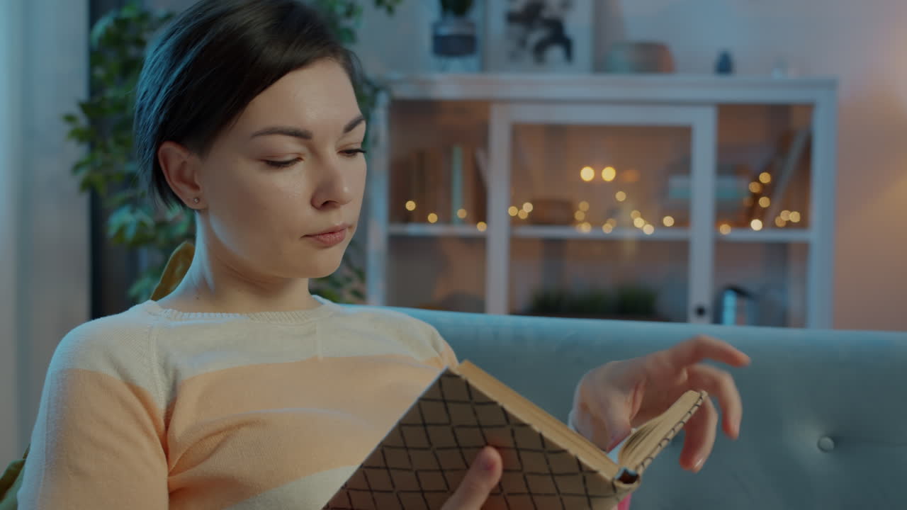 Woman Reading a Book at Home