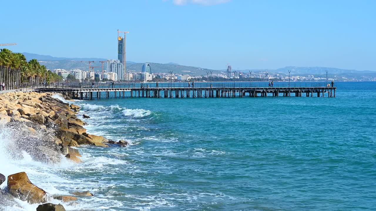 Waves hitting over rocks on the shore in Limassol, Cyprus