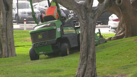 Powered-lawnmower-driving-over-grass