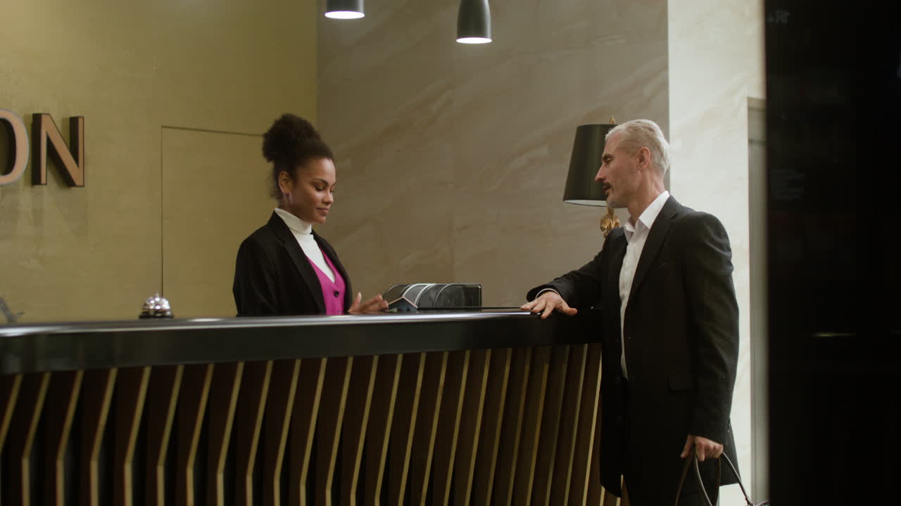 Receptionist performing the check-in process