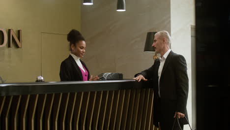 receptionist performing the check-in process