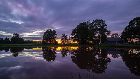 perfect mirror reflections on clear water of a lake during sunrise until sunset