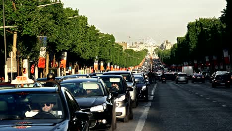 timelapse of traffic on champs elysee and observation wheel in paris, francel in paris, france