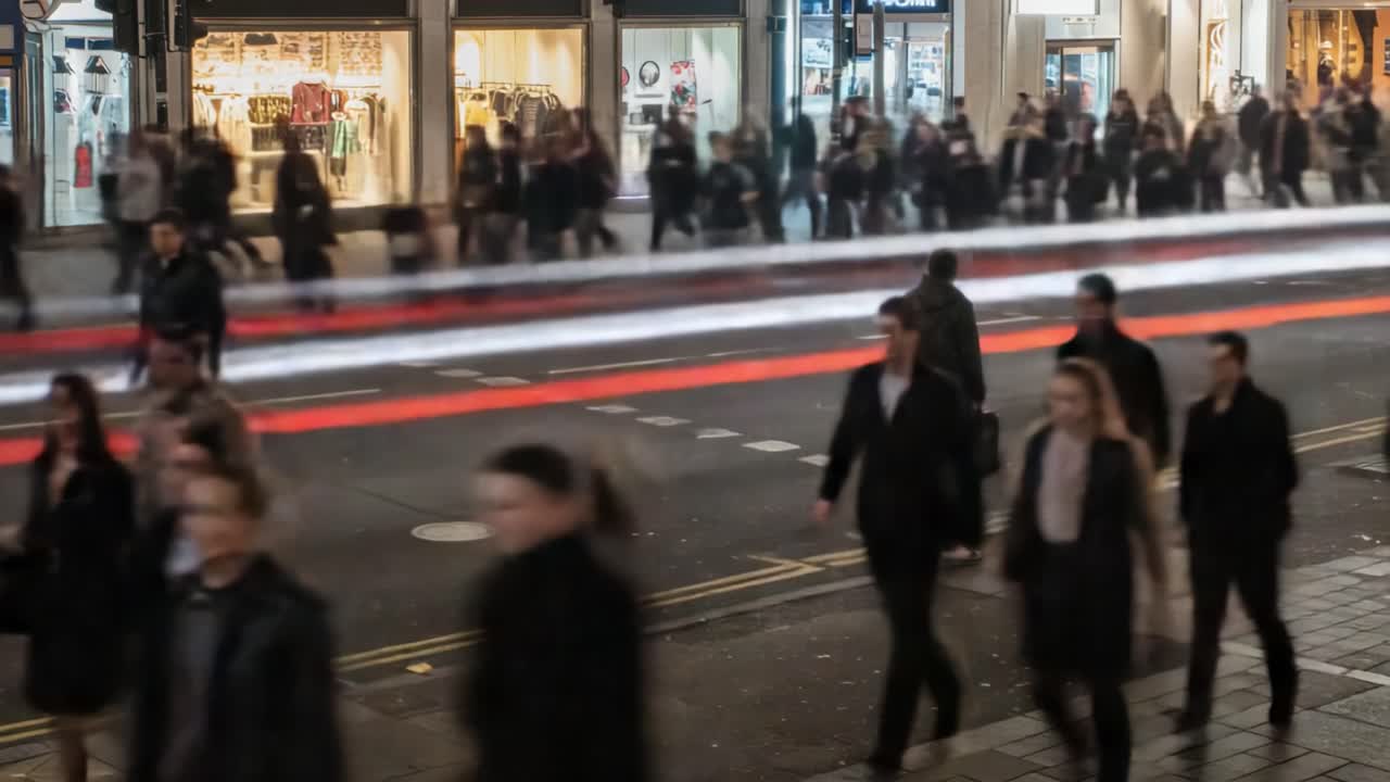 A Bustling Evening Street Scene Capturing the Vibrancy of Urban Life with Pedestrians Moving Amidst Storefronts and Traffic Lights