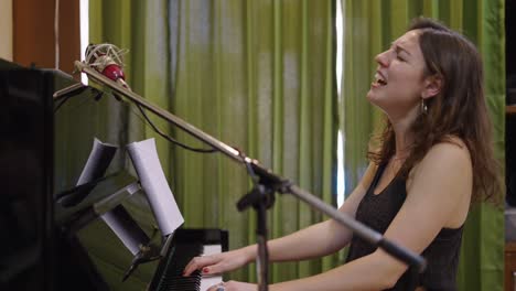 female musician singing and playing piano