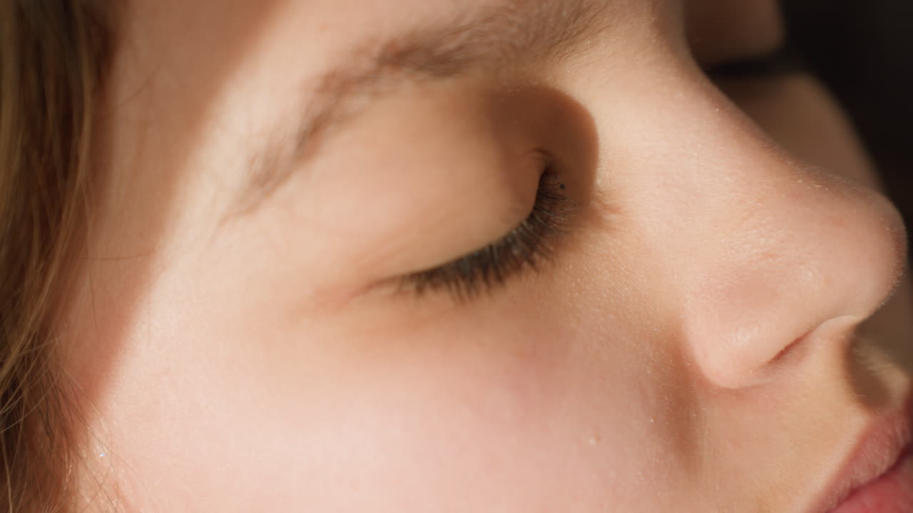 Peaceful Young Girl With Gentle Expression, Tranquil Teenage Girl Shown In Soft Side Profile By Sunlight, Calm And Reflective Adolescent Girl Depicted With Delicate Features Near Window