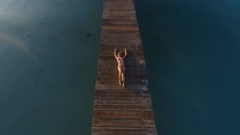 woman lying on the jetty