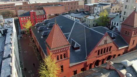 aerial pullback reveals central market brick building, lancaster pennsylvania, usa