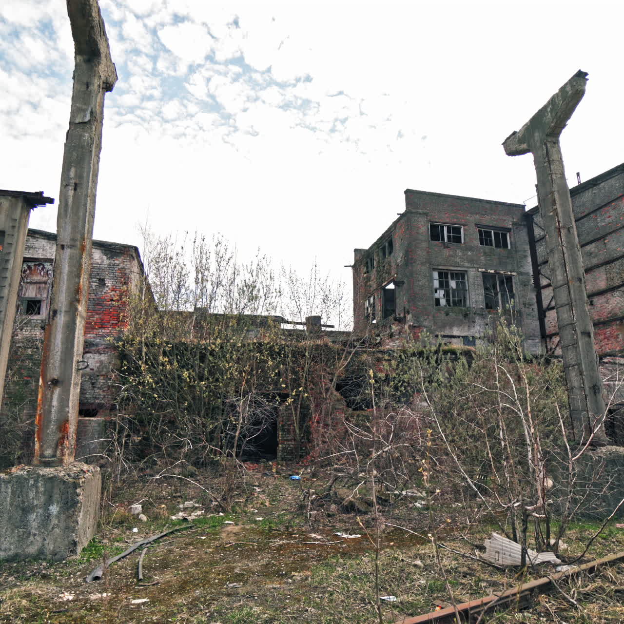 Old industrial building for demolition. large ruined abandoned factory hangar or warehouse.