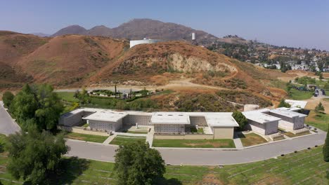 Wide-panning-aerial-shot-of-a-large-stone-mausoleum-at-a-California-mortuary