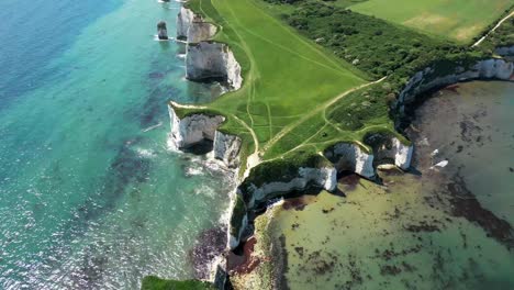 an aerial drone reveal shot of old harry rocks on the jurassic coast of dorset