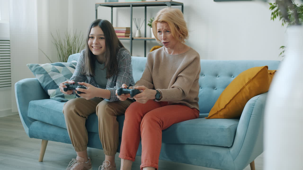 Grandmother and Granddaughter Playing Video Games