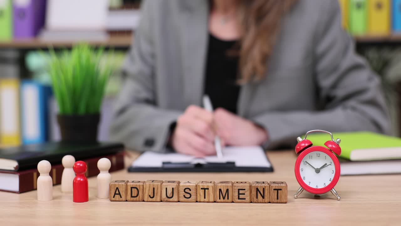 Adjustment concept with wooden cubes and office setting
