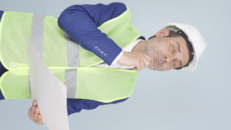 vertical video of the engineer watching the construction is thoughtful.