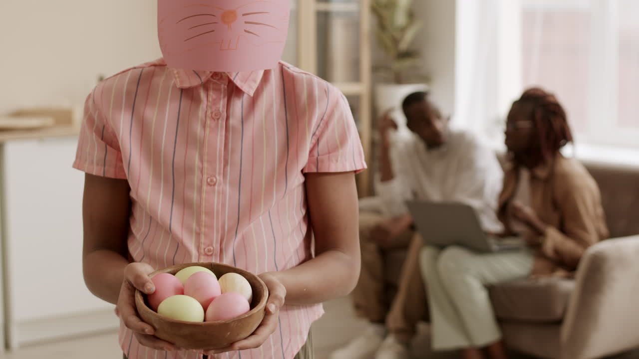 Person with Bunny Muzzle Mask Holding Eggs
