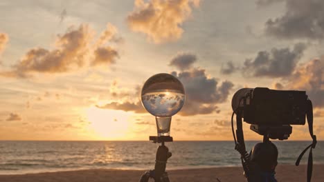 the camera is taking a picture of a glass ball.