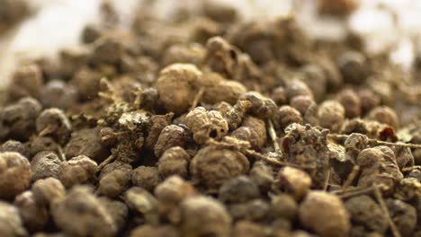macro shot of madder plant root falling into a pile, natural herb used for medicine and dye