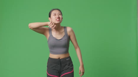 woman in sportswear experiencing discomfort or pain