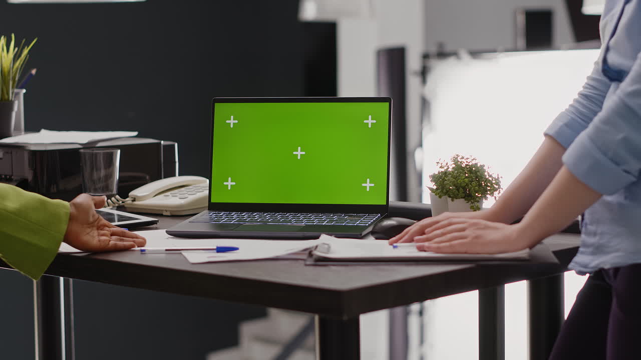 Office Collaboration with Green Screen Laptop