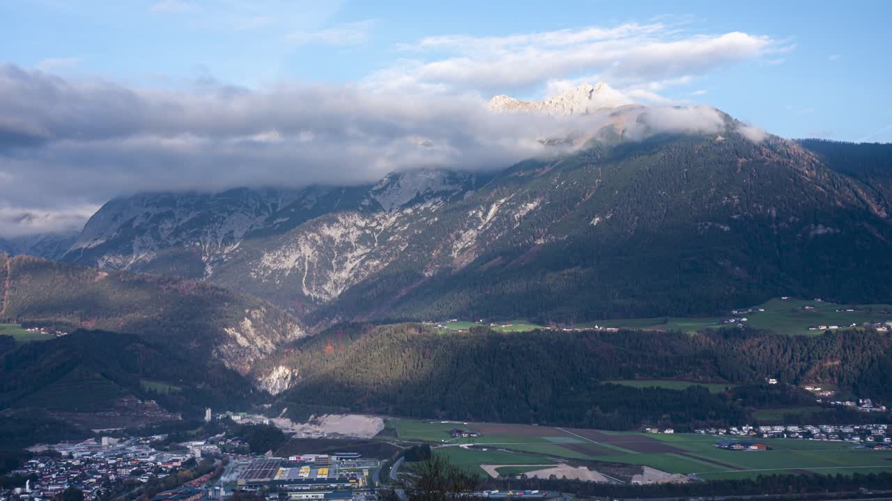 A breathtaking panoramic timelapse of the mountains in Schwaz, Austria. The camera moves from left to right, capturing the stunning alpine landscape and drifting clouds.