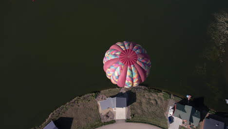 aerial view of hot air balloon above lake and landscape of pagosa springs, colorado usa