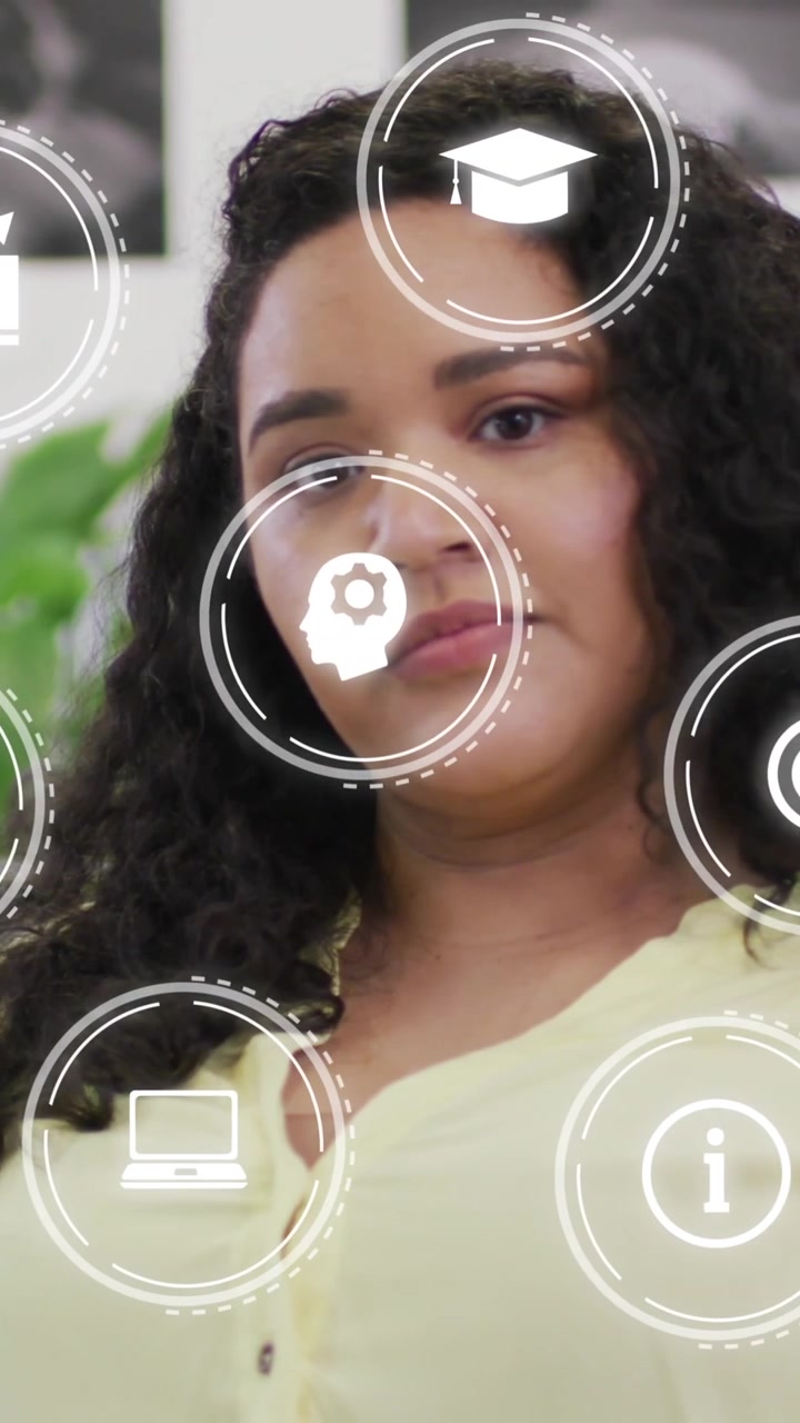 Animation of icons over businesswoman at office