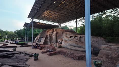 impressive gal vihara rock temple with its ancient statues of a reclining buddha and several standing buddhas