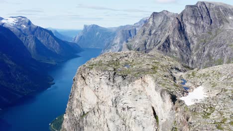 Magnificent-Scenery-Of-Rocky-Mountains-And-Blue-River-in-Norway---aerial-shot