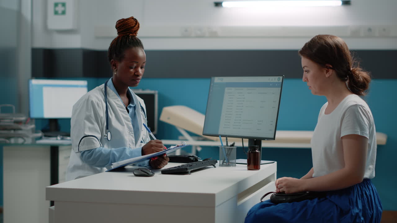 Doctor Consulting with Patient in Clinic