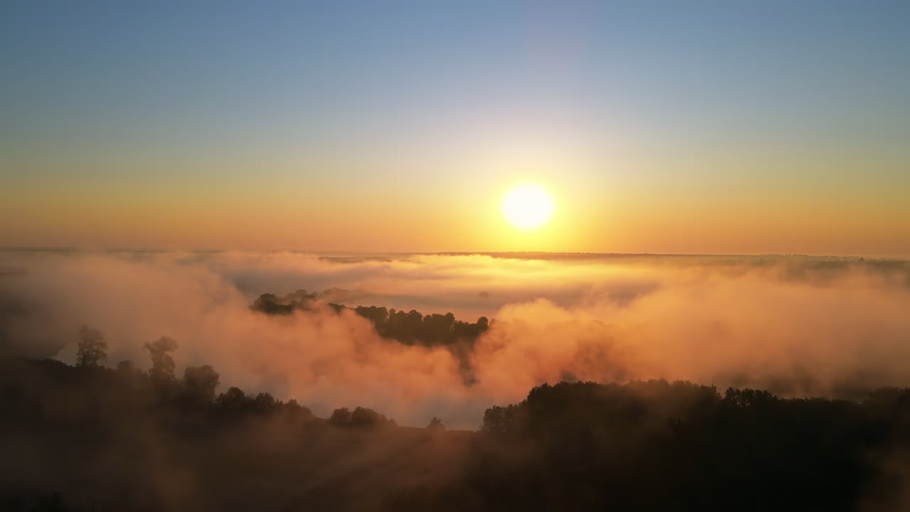 Aerial drone view of nature of Moldova at sunset. River and lush fog above it, greenery