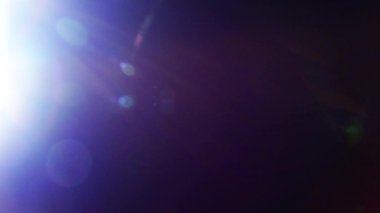Transição Abstrata de Efeito de Luz em Fundo Preto