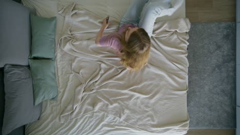 woman relaxing on bed