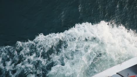 a top down shot of the wake from a cruise ship