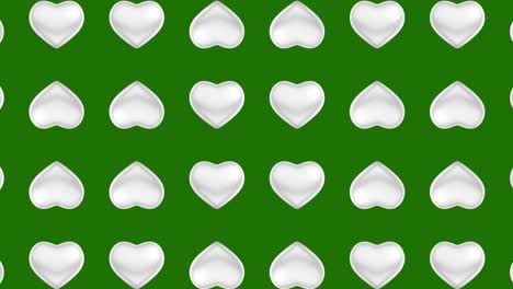 white hearts pattern on green background